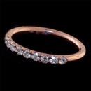 Our beautiful and classic 18kt rose gold diamond wedding band set with .55ct of VS F-G ideal cut diamonds. This band is 2.3mm in width and the diamonds are set 1/2 way around the ring. Available in 18kt yellow gold and platinum. Perfectly symmetrical. Very durable ring and handmade in America. The best of the best.