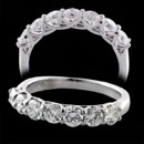 Our Classic 18kt white gold diamond ''Trellis'' wedding band. This is the best band like this you can buy!   This piece is set with 7 diamonds weighing 1.0ct total. The diamonds are VS F-G quality. The ring is 3.25mm at the top and tapers. A shared prong setting as fine a setting as you will see. Available in a variety of sizes. 