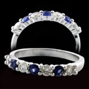 Our Classic 18kt white 4 prong Sapphire and Diamond band.  The ring is set with .34ct of intense blue Swiss cut sapphires and .38ct of diamonds SI H quality.  The ring measures 2.8mm at the top.  Available in all sizes.