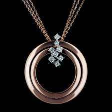 Beautiful 18kt rose gold, white gold, and diamond necklace by Damiani. The piece suspended on a 20" chain measures 29mm in diameter, with .33ctw. Matching earrings also available.