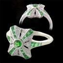 A beautiful 18kt white Beverley K art deco ring. This ring features vibrant green emeralds and diamonds. Beautifully set emeralds on the side. This ring is photo'd in 18Kt gold, but can be made in different metals. Other colored stones available and platinum.