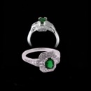 This Beverley K Octagonal ring has a round .52kt emerald in the center and is surrounded by .50kt of gem diamonds  which continue down the front of the band. The square diamonds placed on the left and right of the emerald give this ring a nice symmetry and an art deco look. 