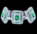Cushion styled ring with a gorgeous Emerald gem center outlined with diamonds and more emeralds. A total of 1.10ct Emeralds, and .3ct of Diamonds. Available in 18K white or yellow gold, and platinum. Also available in a variety of stones. 