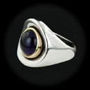 Item 257CO1 - Sterling Silver and 18kt yellow gold ring with cabachon cut Iolite by Robert Lee Morris. Ring size 6.25