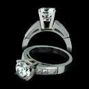 An exquisite example of platinum bridal. The Jeff Cooper semi mount features .40cts of round and baguette cut diamond channel set in a finger size 6. The four prong head will accommodate a 7mm center stone. 3.5mm width