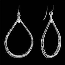 These are a pair of sterling engraved hooped earrings designed by Scott Kay Sterling. 