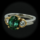 Item 290CO1 - This piece is a Richard Krementz piece and he was know for his use of extremely fine color. The piece is in Platinum and 18kt yellow gold and contains a 2.01ct. chrome tourmaline in the center and two full cut round brilliant diamonds one on either side with a total diamond weight of .40ct. Size 6