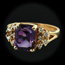 Item 292CO1 - This 14kt yellow gold ring is set with an intense natural Amethyst measuring 9mm x 7mm and on either side of the stone are set 5 full cut diamonds, 10 in total for a total diamond weight of .40ct. Size 6