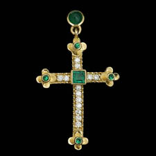 Wonderful 18kt gold emerald and diamond cross.  The piece is set with 1.02ct of gem emeralds and .39ct of diamonds. VS G-H quality.