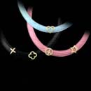 Honora Necklace 29Z3: Sparkling and whimsical: Yellow gold and diamond slides (peace signs, crosses, stars, and hearts) come with one black and one pink strap necklace, allowing you to create multiple fun looks. The baby blue strap is an extra accessory at $30. All are from Honora. Honora Necklace 29Z3 jewelry