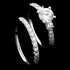 Delicate detail: Platinum and diamond engagement ring by Scott Kay with .32ctw in accent stones. Center stone not included. Matching wedding band completes the look.