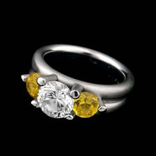 Whitney Boin platinum post triad mount engagement ring with yellow sapphire sides.