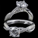 Beautiful little platinum engagement ring with cross over shank by Harout R. The ring is shown with a 1.00 carat diamond center, but is available from 0.50 carats and up. In addition the ring is set with 0.22 carats in round brilliant cut diamonds. The ring measures 4.45mm in width. This ring is also available in 18 karat gold. The center diamond is not included in pricing.