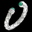 A unique sterling silver emerald open ring. The ring has a woven pattern with a open design. The emerald has a total carat weight of 0.30. The finger size is 7.25.
