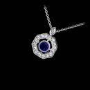 This beautiful 18kt white gold sapphire and diamond pendant by Beverley K contains .07ct. in diamonds surrounding the bezel set sapphire weighing .13ct.  