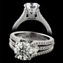 A stunning Peter Storm Naked Diamond throw row engagement ring.The center stone is preferred to be between 1-2.5 carats. There are two princess cut diamonds on each side of the center with the middle row descending back to half of the ring. This ring features 70 diamond total and is available in 18k gold and platinum.