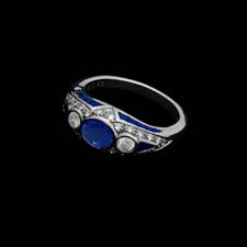 This delightful platinum ring from the Pearlman's Collection features a .92ct. sapphire center stone flanked by .21cts. in round diamonds. The bezel is set with .26cts. in sapphires and .26cts. in diamonds.