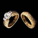 A beautifully textured 18kt gold engagement ring by Alex Soldier. Total diamond weight of .80ct. Center diamond not included. Wedding band $3,300.
