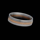 Designed by Christian Bauer, this sophisticated 6mm wedding band is created in platinum and set with 18K red gold in the center.
