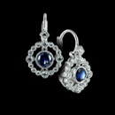 These are a pair of 18k white gold diamond and sapphire earrings from Beverley K.  The bezel set blue sapphire is surrounded by a round bezel set diamond border.  There are .77ctw of blue sapphires and .09ctw of diamonds.  