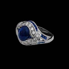 This gorgeous and unique platinum ring from the Pearlman's Collection features an impressive 2.73ct. cabechon sapphire surrounding by bands of melee diamonds (.46cts.) and sapphires (.90cts.).