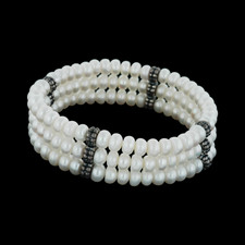 A gorgeous three stranded white pearl bracelet with sterling silver end caps, designed by Honora.