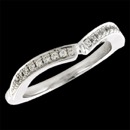 A one of a kind wedding band from Eddie Sakamoto. The band features a groove in the center to fit most of Eddie Sakamoto engagement rings. The diamonds go halfway down the shank. The ring measures 2.03mm at the thinest part and 2.37mm at the widest width. This ring can be made in 14k, 18k, or platinum.