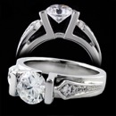 A gorgeous 18k white gold Eddie Sakamoto design ring. This ring side diamonds go 1/4 of the way down the ring. The ring measures 4.8mm at the wider part of the ring and tappers down to 3.4mm. The ring sits 7.6mm above the ringer. The side diamonds have a total carat weight of 0.12tcw. Can be made in 14k gold, 18k gold, and platinum.