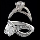 A beautiful 18k white gold twisting engagement ring designed by Eddie Sakamoto. This ring is holding a 1 carat diamond, but can accommodate many other size carats. The side stones have a total carat weight of 0.28tcw. This width of the base on the shank measures 3mm. This ring looks great on any finger. The mounting does not sit too high above the finger. The ring sits 8.9mm above the finger. This ring can be made in 14k gold, 18k gold, and platinum.