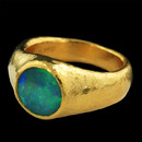 Gurhan Ring 59GG1: This deep and intense one of a kind Gurhan piece features an 8mm round polished opal stone set in the contrast of Gurhan's hammered 24kt pure yellow gold. Gurhan Ring 59GG1 jewelry