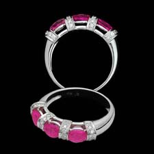 Exclusive from the Pearlman's collection, this lovely 18K white gold band shines with three round pink sapphires (1.32ct.tw.) seprated by .21cts. in diamonds. Lovely on its own or as part of an engagement set.
