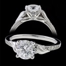 A lovely platinum diamond side stone Bridget Durnell engagement ring. The side of the ring features an art deco inspired leafs surrounds the center diamond. The profile of the ring has four leaf pedals holding the diamond in a very unique setting. The diamonds of the side have a total carat weight of 0.1. Center diamond is not included.