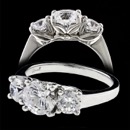 A pretty platinum three stone diamond Bridget Durnell engagement ring. The two diamond of either side of the center stone have a combined weight of .65tw. The center stone is around a 1 carat. The price does not include the center diamond.