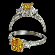 A Michael Beaudry platinum Adia Diamond ring. The ring is set with one 1.14ct Fancy Vivid Orange Yellow Adia diamond. The stone is a SI2. The mounting contains .36ct of white diamonds. This was a custom created piece, please call for comparison pricing information.