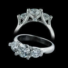 Stunning new "Twin Set" 3 stone ring in platinum by Gumuchian. This ring is set with a .88ct center diamond with .66ct of sides and diamond prongs.  All diamonds are VS G-H ideal cuts. 5.25 Size. Available in larger sizes.
