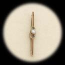 A 9 kt. yellow gold cultured pearl and sapphire ca 1890's.  The piece measures 52mm x 6.5mm.