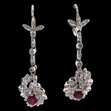 A wonderful pair of 18 kt. white gold ruby and diamond drop pierced lever-back earrings ca 1950's.  The pair has approximately .50 ct of rubies and .60 ct of diamonds.  They measure 43mm in length and 11mm in width.