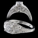 A stunningly beautiful handmade die struck filigree diamond ring. The ring is set with .20ct of VS F ideal cut diamonds. Totally carved by hand and made for a .50ct to 1.50ct diamond (center diamond not included. 7.8mm top width and tapers. Available in 18kt & 14kt white or yellow gold. Made in the USA!!