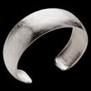 A pretty bangle bracelet with a sophisticated flare. This bracelet is from German designer Bastian Inverun. The bracelet is made of sterling silver and features a scratch finish. The width of the bracelet is 24.7mm. The bangle is flexible and can fit many wrist.