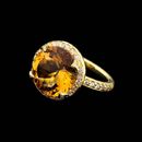 Amazing SeidenGang 18kt gold and diamond ring set with a round 14mm citrine. The ring is accented with .52ctw in diamonds.