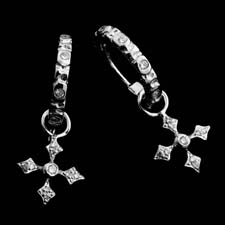 These stunning platinum and diamond hoop earrings are enhanced with a removable diamond platinum cross charm.
