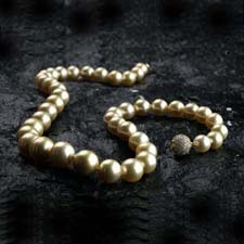 Golden south sea pearls with diamonds in the clasp