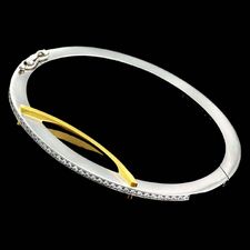 Ladies platinum and 18kt yellow gold bangle bracelet designed by Eddie Sakamoto, with .49ctw of diamonds.