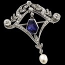 Platinum Garland period pin circa 1912 Beautiful piece set with 47 single, rose, and European cut diamonds weighing approx 1.0ct.  8 x 6 1/2mm calf's head natural blue sapphire. 6mm natural pearl. The piece measures 41 x 35mm. The sapphire is GIA certified color change sapphire ( 2 colors)
