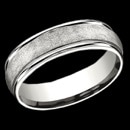 A great looking man's wedding band that is made 14k white Gold from Benchmark. This Benchmark ring measures 6.5mm and is a Comfort-Fit band. It features high polish round edges and a swirl fiberglass finish on the center. This Benchmark mens ring is priced at a size 9, but can be made in other finger sizes. Prices will vary depending on finger size.

