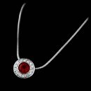 Chris Correia Platinum and bezel set ruby pendant with bead set diamonds on a snake chain. The ruby measures 4mm in size.