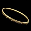 Charles Green's beautiful handmade 18kt yellow gold bangle bracelet. This bracelet features with hand engraving and is 6mm in width. This is an exquisite hinged bracelet that could be stacked with other bracelets of beautiful enough as a stand alone. 