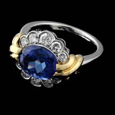 18kt yellow gold and platinum tanzanite weighing 3.40cts and diamonds weighing .72cts. ring. The finger size is 6.25.