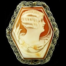 A unusual 14kt white gold filigree shell cameo pin. Beautiful carving and the filigree mounting is in excellent condition.  The pin measures 35mm x 30mm and weighs 5.9 grams.  All gold pieces are also tested by us.  You'll like this one!