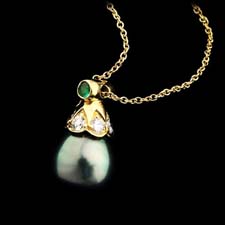 18kt. gold, diamond, and emerald pearl-drop pendant from Gumuchian. Very nice and available in platinum with a variety of pearl colors.
